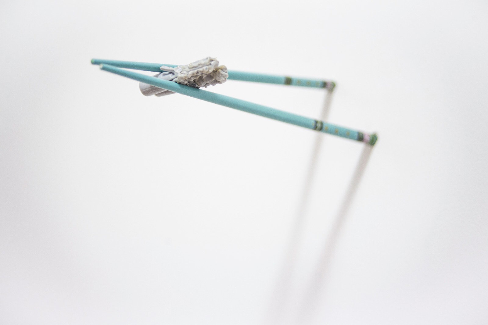 Destreza y torpeza, X, 2017 Chopsticks and bitten Fischer wall plugs