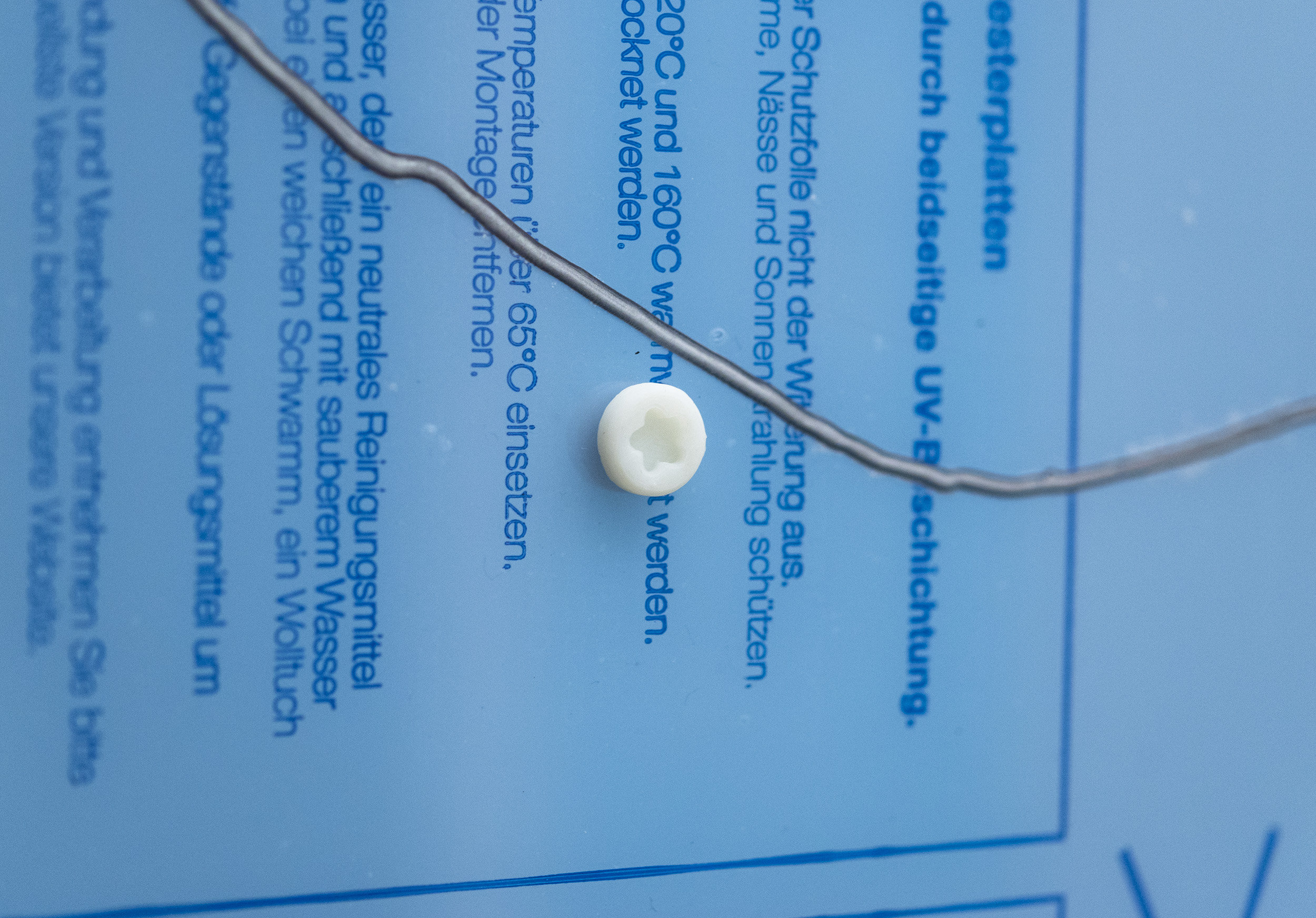 Handy Rule No. 1, 2016 Two polyester panels, industrial screws, 3D-printed screws (ABS), commercial aspirin, domestically synthesised aspirin and wall dust 180 
